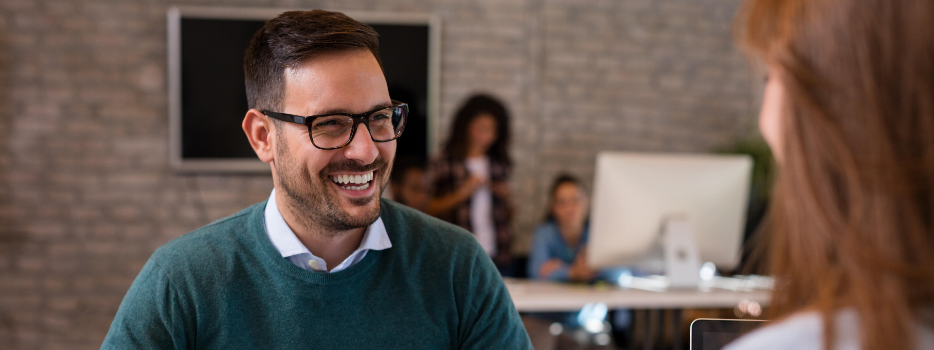 smiling man conducting interview